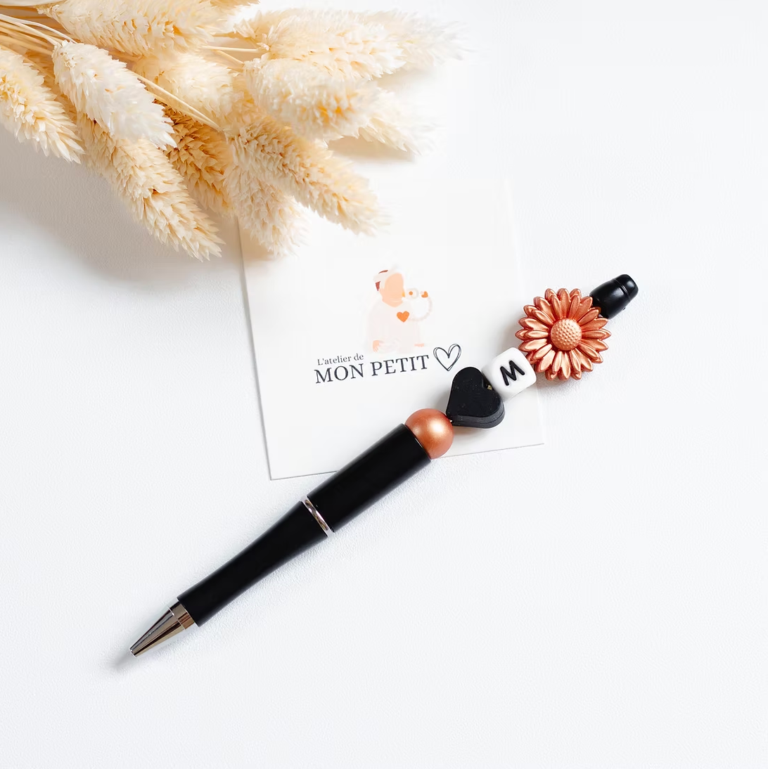 Stylo fleur or rose